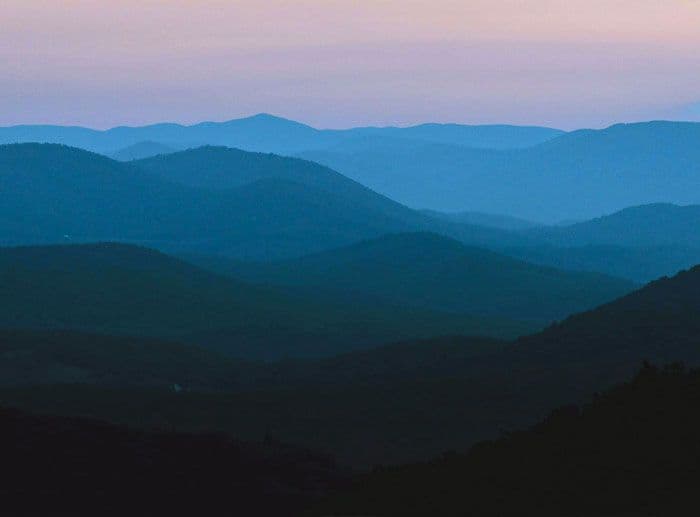 A purple and blue mountainscape
